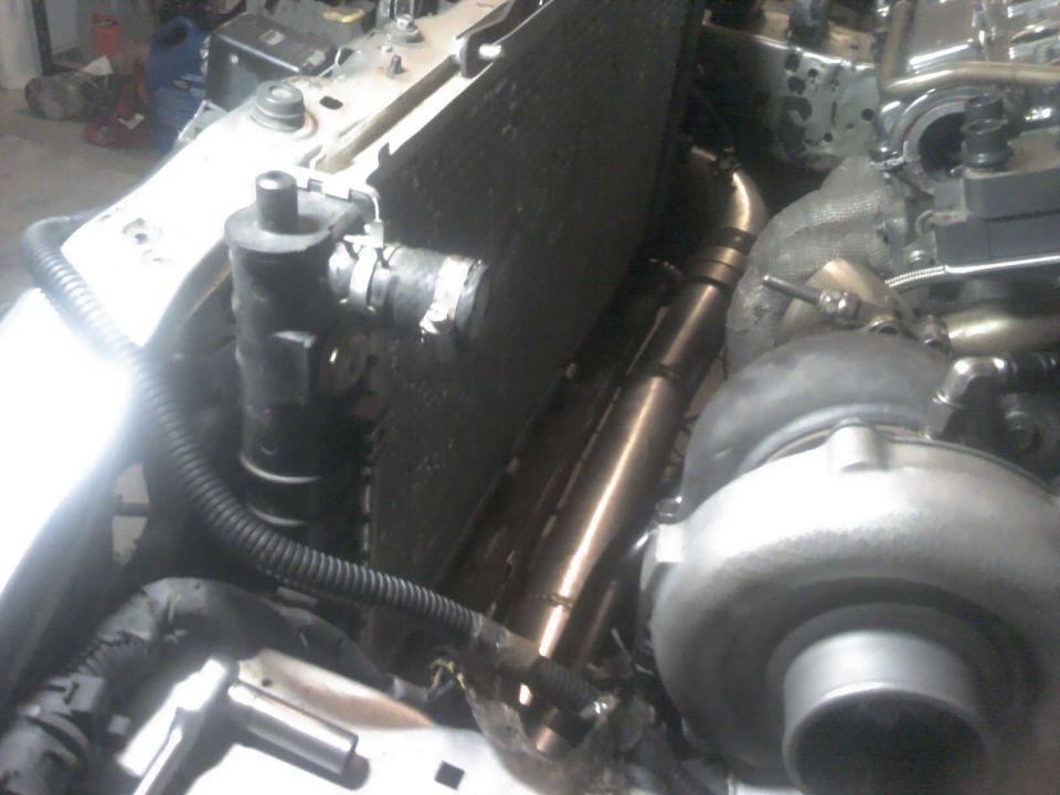 close-up of turbocharger and radiator in an engine bay