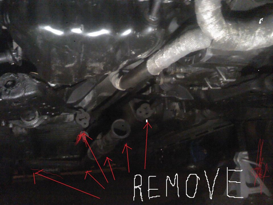 Underside of vehicle showing exhaust pipes and suspension parts. Red arrows point to components, and the word 'REMOVE' is written
