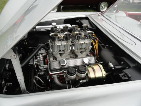 1964 Ford Fairlane - Engine bay detail showing a V8 engine with a six-carburetor setup.