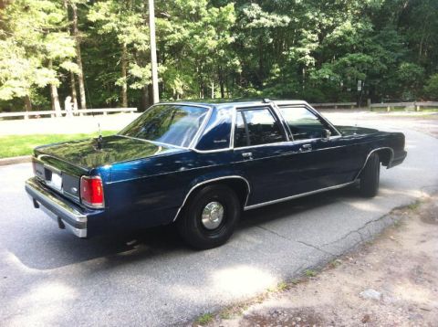 1991 Ford LTD Crown Victoria - Rear three-quarter view of a 1991 Ford Crown Victoria LTD sedan.