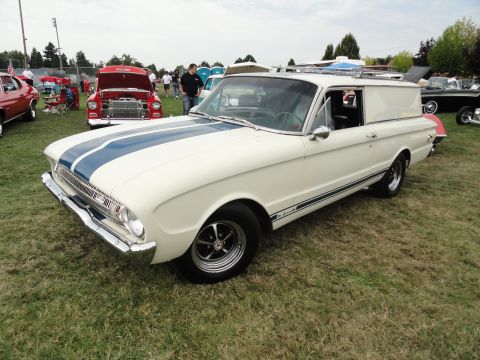 1964 Ford Fairlane - White 1964 Ford Falcon Ranchero sedan delivery with blue racing stripes at a car show.