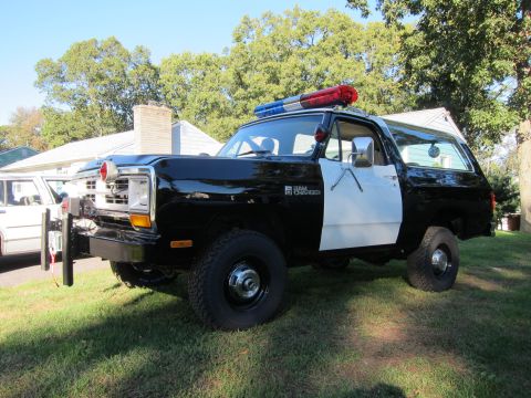 1987 Dodge 1500 - This Ram Charger SUV is outfitted as a police vehicle with a light bar and push bumper.