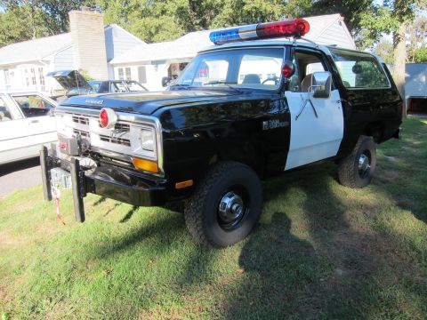 1987 Dodge 1500 - This 1987 Dodge Ramcharger served as a police vehicle, distinguished by its two-tone paint and emergency lights.