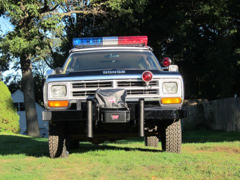 1987 Dodge 1500 - This 1987 Dodge 1500 pickup truck is equipped as a police vehicle, a light bar and a heavy-duty push bumper.