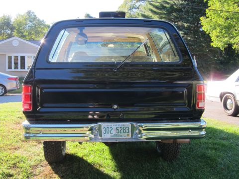 1987 Dodge 1500 - Rear view of a black 1987 Dodge Ramcharger, showing its taillights and chrome bumper.