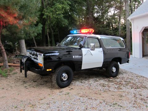 1987 Dodge 1500 - This 1987 Dodge Ramcharger is outfitted as a police vehicle with a light bar and push bumper.