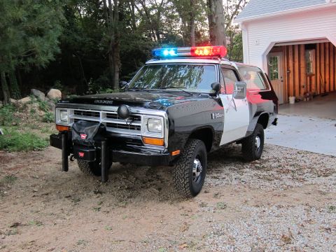 1987 Dodge 1500 - This Dodge Ramcharger is equipped with a light bar and a winch, suggesting it may have been a police or emergency vehicle.