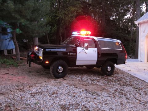 1987 Dodge 1500 - This Dodge Ramcharger is outfitted as a police vehicle, complete with a light bar and push bumper.