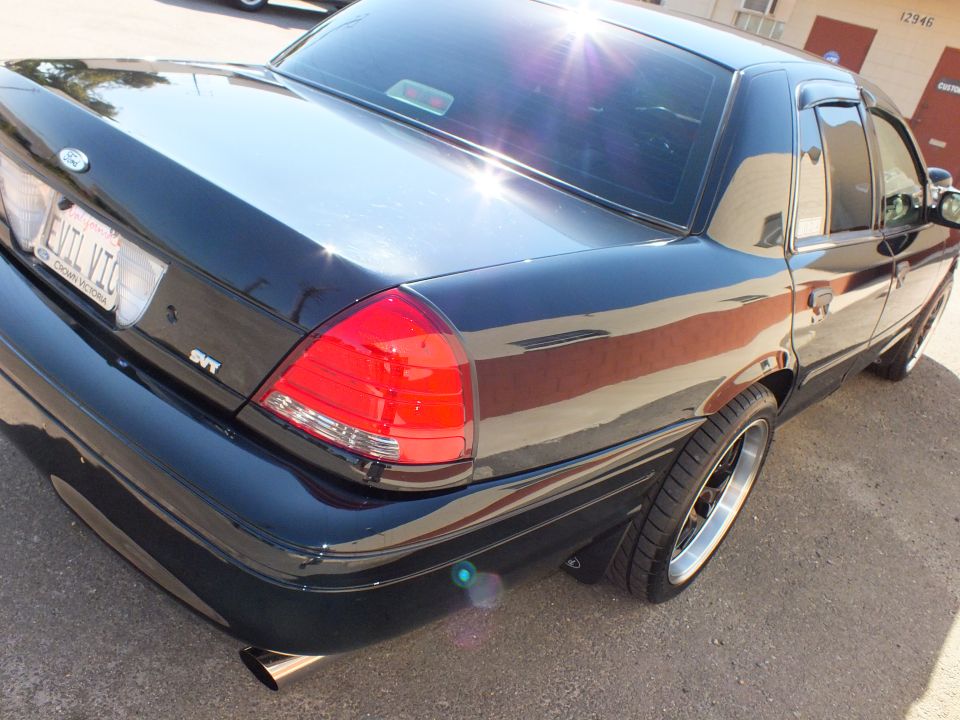 Black Crown Victoria rear quarter closeup with SVT badge and red taillight