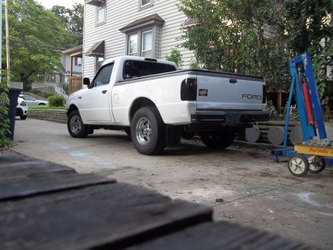 1970 Ford Ranchero - White Ford Ranger pickup truck parked in a driveway, showing the rear and side profile.