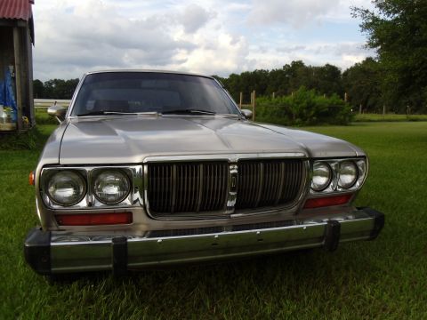 1978 Nissan Maxima - This Datsun 810 sedan features a prominent chrome grille and dual headlights.