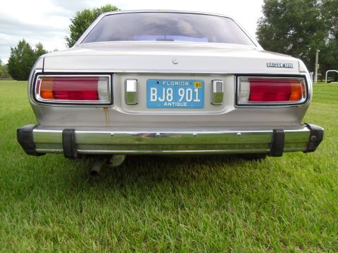 1978 Nissan Maxima - Rear view of a silver 1978 Nissan Maxima sedan with a Florida antique license plate.