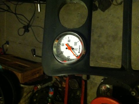 1993 Ford Probe - An oil pressure gauge is mounted in a black dashboard panel.