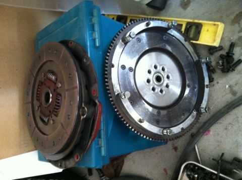 1993 Ford Probe - Clutch and flywheel assembly components are shown resting on a blue box.