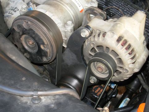1997 Chevrolet Silverado 3500 - The plasma-cut brackets fit, and the thicker metal puts the idler pulley in perfect line. It's not apparent due to the shadows, but the pul…