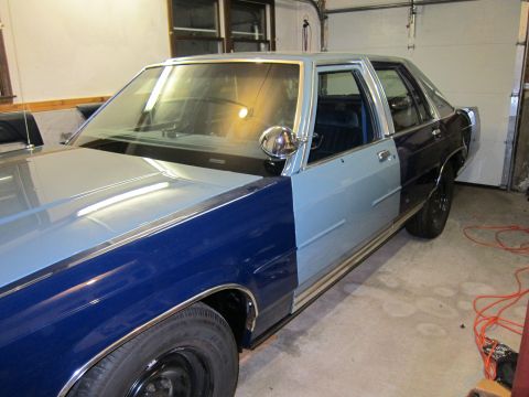 1991 Ford LTD Crown Victoria - This 1991 Ford Crown Victoria LTD shows mismatched paint on its front fender and door, suggesting a project in progress.