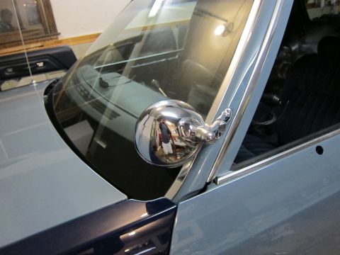 1991 Ford LTD Crown Victoria - The shiny chrome side mirror reflects the interior of the vehicle and the photographer.