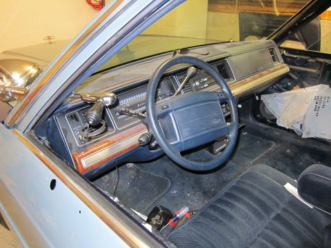 1991 Ford LTD Crown Victoria - Dashboard and interior of a 1991 Ford Crown Victoria LTD, showing the steering wheel and seats.