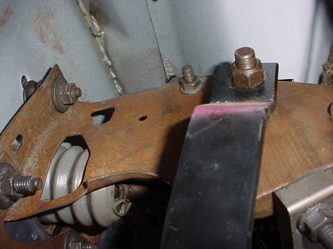 1991 Ford LTD Crown Victoria - Close-up view of a rusty pedal assembly, showing springs and mounting hardware.