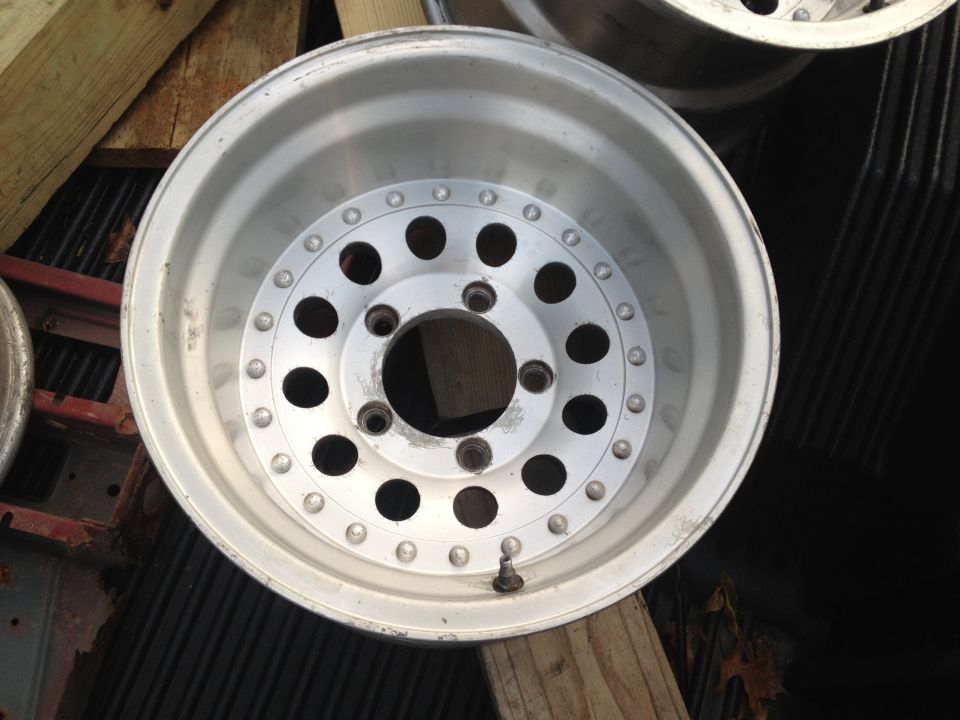 Aluminum wheel with multiple bolt holes and a valve stem