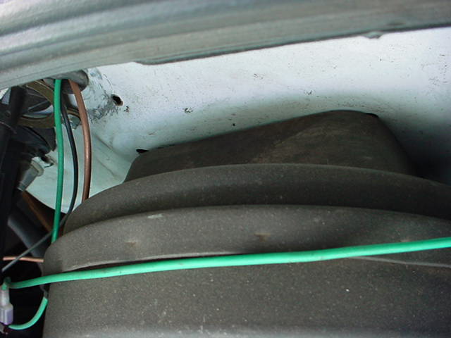 Engine component with green and brown wires