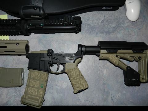 1996 Ford Bronco - AR-15 lower receiver assembly with attached magazine and optic, alongside a barrel section.