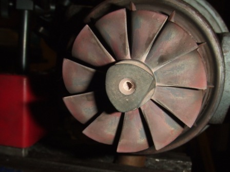 1996 Ford Bronco - Close-up of a turbocharger compressor wheel, showing signs of wear and discoloration.