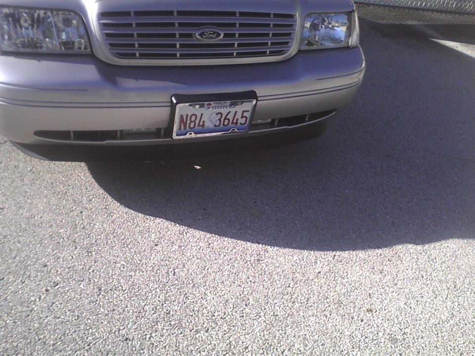 Front of a silver 2003 Ford Crown Victoria with a license plate that reads N84 3645