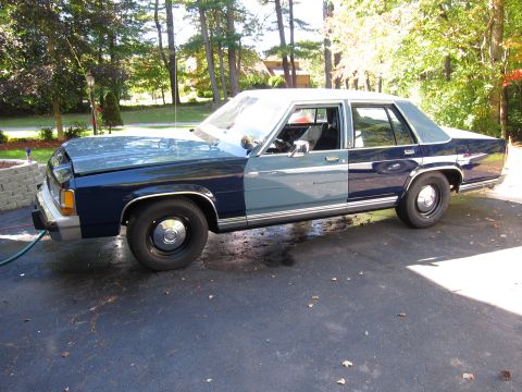 1991 Ford LTD Crown Victoria - Side view of a two-tone blue 1991 Ford Crown Victoria LTD sedan.
