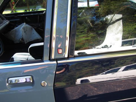 1991 Ford LTD Crown Victoria - Interior view of a 1991 Ford Crown Victoria LTD, with a plastic bag on the seat.