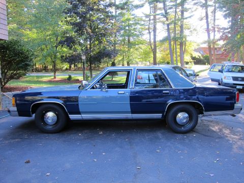 1991 Ford LTD Crown Victoria - This 1991 Ford Crown Victoria LTD has a two-tone paint scheme and is parked in a residential driveway.