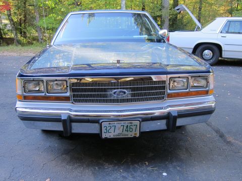 1991 Ford LTD Crown Victoria - Frontal view of a Ford Crown Victoria, with another vehicle visible behind it.