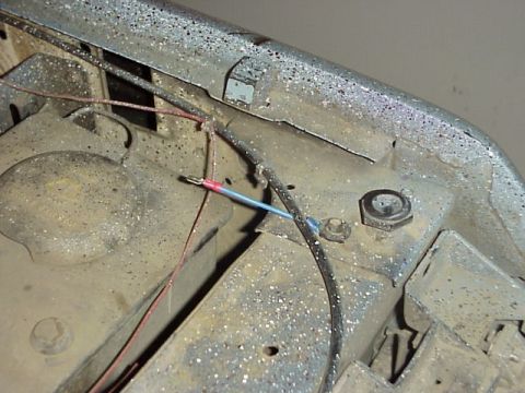 1989 Ford Bronco - Close-up of engine bay wiring shows a connection with red and blue wires.