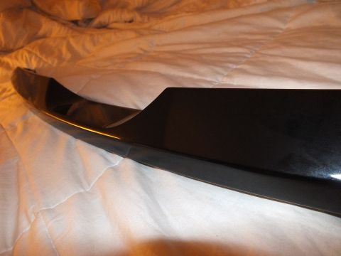 2003 Ford Crown Victoria - Detail of the broad mounting face of a black decklid spoiler on a comforter