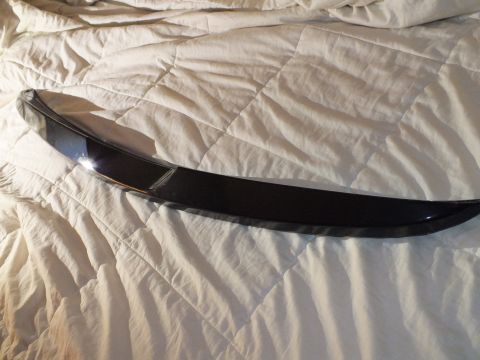 2003 Ford Crown Victoria - Full-length black decklid spoiler photographed on a quilted bedspread