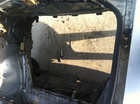 1993 Ford Probe - This car's interior shows severe damage to the rear passenger side paneling and structure.