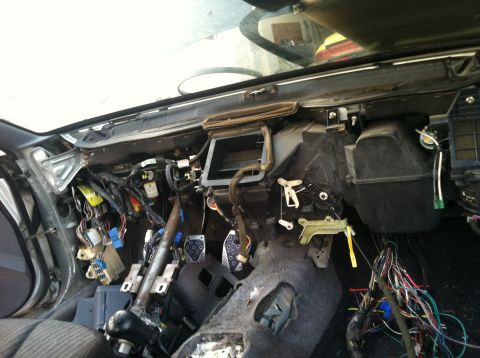 1993 Ford Probe - Dashboard wiring and HVAC system exposed for repair or modification.