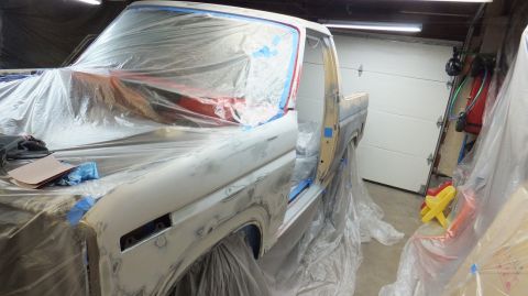 1983 Ford Bronco - This 1983 Ford Bronco is being prepped for paint, covered in protective plastic sheeting during bodywork.