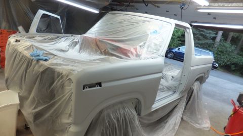 1983 Ford Bronco - This 1980s Ford Bronco is covered in plastic sheeting and primer, ready for a fresh coat of paint.