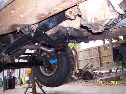 1990 Ford Bronco - Undercarriage view of a 1990 Ford Bronco, highlighting its suspension and drivetrain.