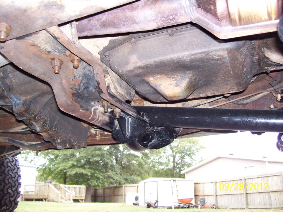 Undercarriage view of a vehicle's drivetrain components and suspension