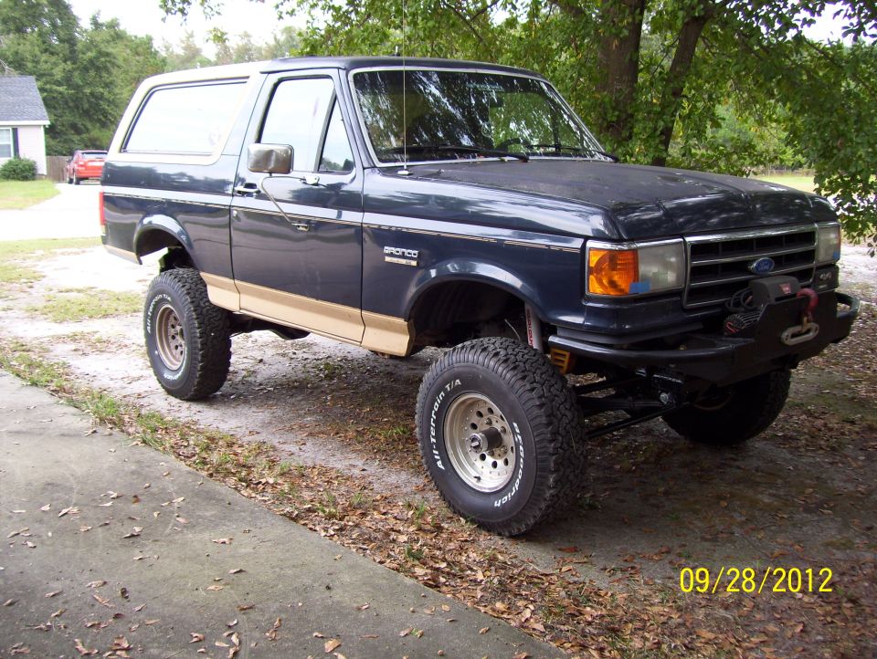 1990 Ford Bronco lifted with off-road tires and winch bumper