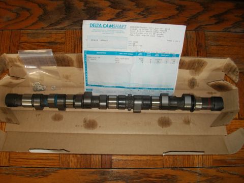 1989 Ford Probe - A camshaft is shown with Delta Camshaft paperwork and associated parts, suggesting a performance upgrade or repair.