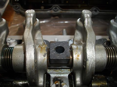 1989 Ford Probe - Engine valve train components, including rocker arms and a central block, are shown in detail.