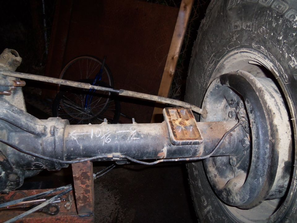 Rear axle assembly with "10 7/16" and "- 72" markings