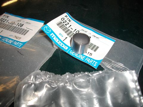1989 Ford Probe - Two packages of Mazda genuine parts pins are shown, one with a single pin visible.