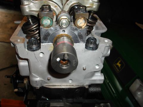 1989 Ford Probe - Close-up view of an engine's cylinder head, showing internal components like the camshaft and valves.