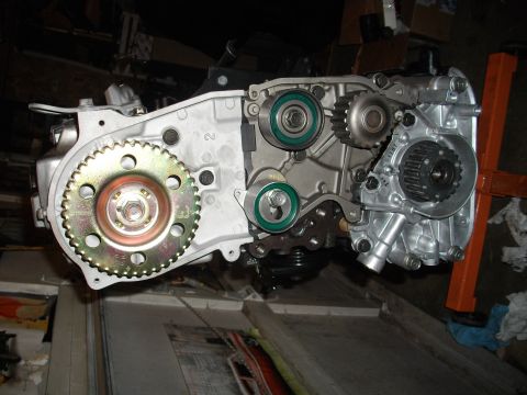 1989 Ford Probe - Close-up view of an engine's timing belt system, showing gears and tensioners.