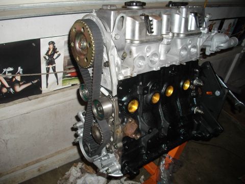 1989 Ford Probe - Close-up of a rebuilt engine, showing the timing belt and associated components.
