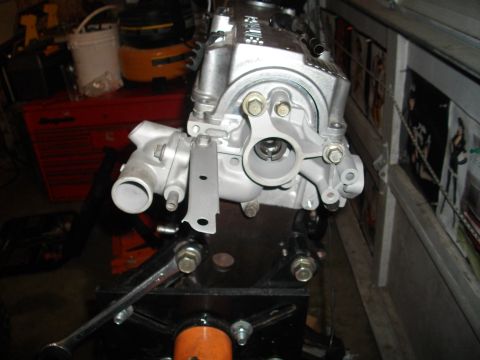 1989 Ford Probe - Close-up of an engine part, possibly a water pump housing, mounted on a stand.